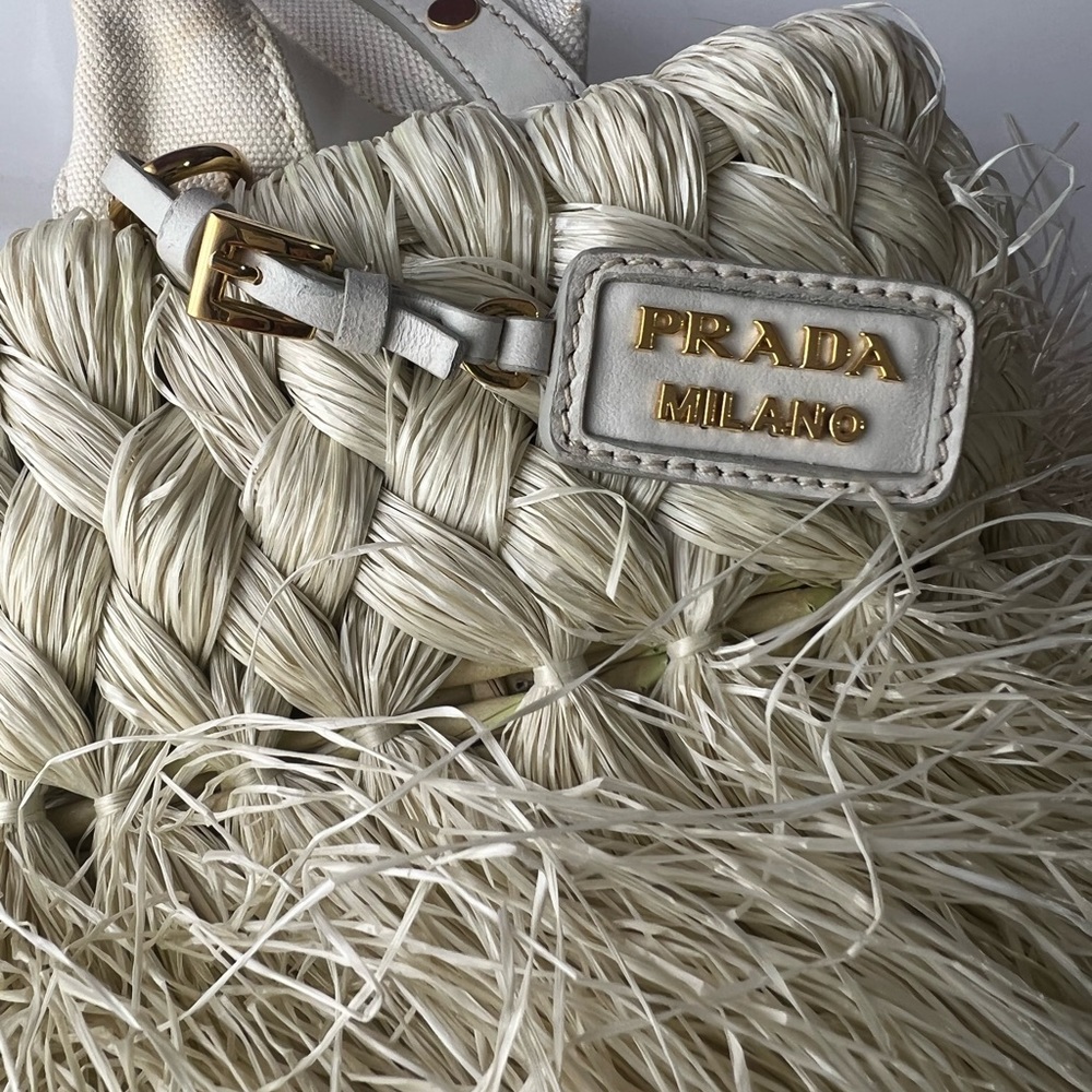 Prada Bags| Prada
Vintage Logo Fringe
Straw Top Handle
Bag Crossbody Bag